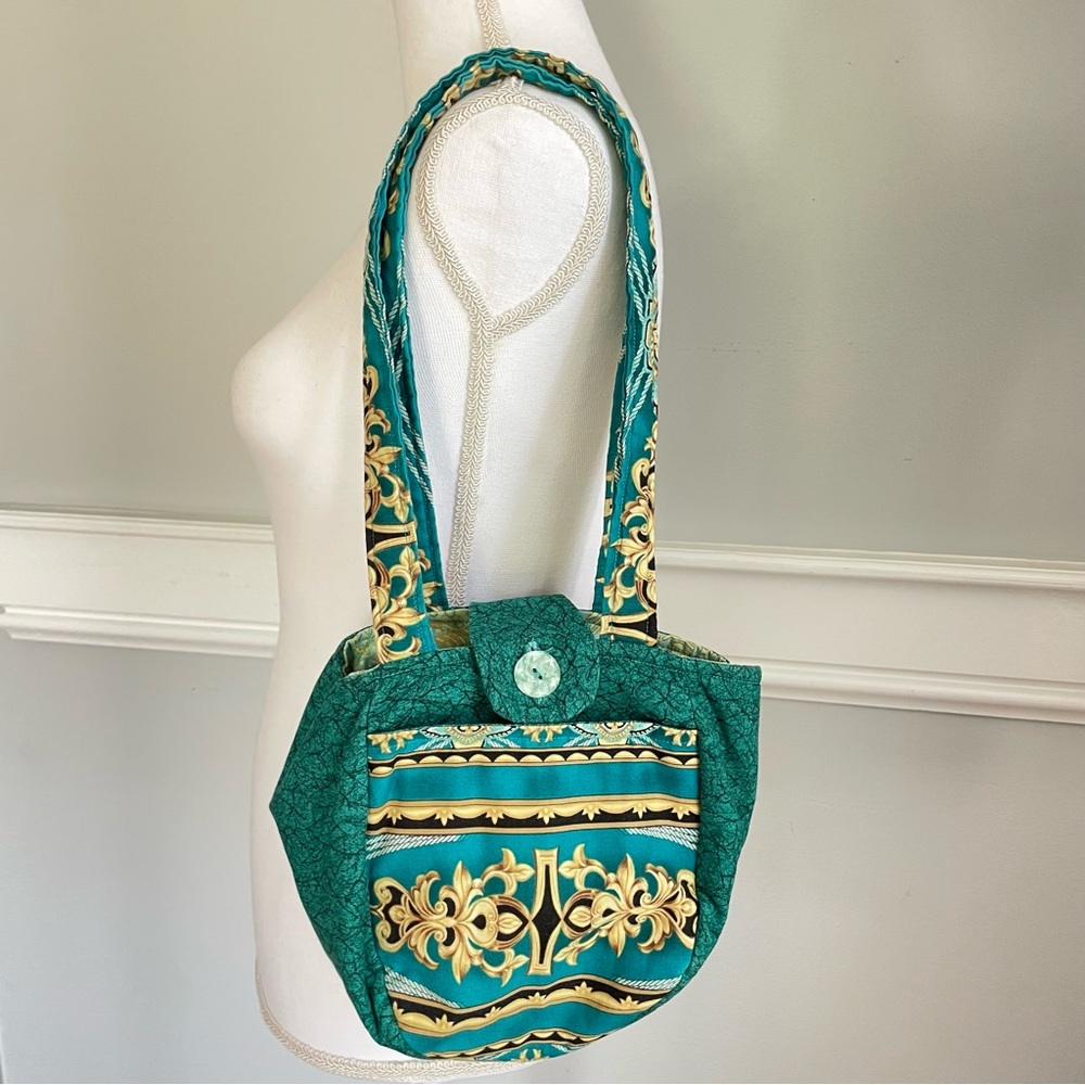 Handmade Luxurious Green and Gold Shoulder Bag with Structured Design